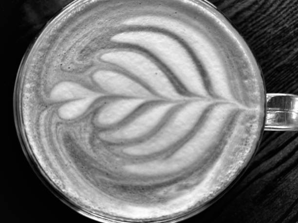 Close up of a cup of coffee with coffee froth art