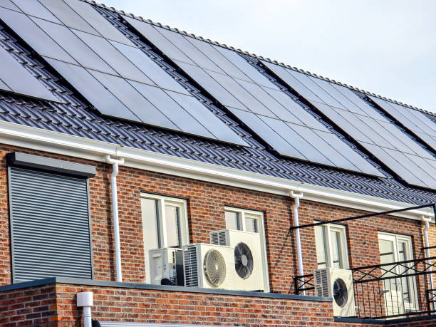 istock air source heat pump unit installed outdoors at a modern home with solar panels in the Netherlands 2148508803