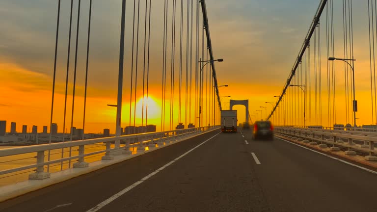 View from a car driving on the highway in the early morning