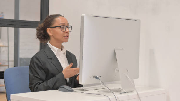 istock Online Video chat on Desktop Computer by Young Business Woman 2148514216