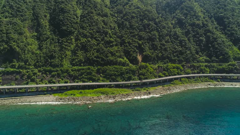 Highway on the viaduct by the sea. Philippines, Luzon