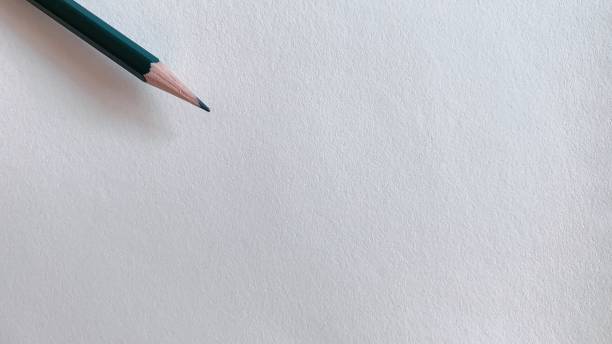 istock paper and pencil on table 2148516584