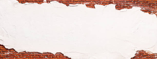 istock brick wall texture with destroyed stucco, background in loft style 2148516850
