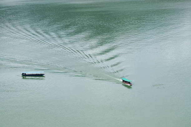 istock A boat is in the water with a green canopy 2148517345