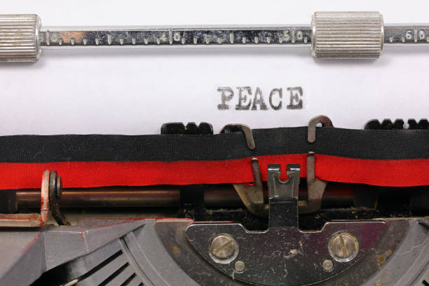 istock peace in black ink on white paper with an old typewriter 2148522452