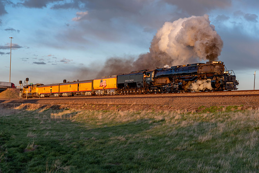 Cheyenne, WY - May 2, 2019: Union Pacific Railroad Big Boy Test Extra 4014 is westbound out of Cheyenne, Wyoming on May 2, 2019.  Train is on the Laramie Subdivision Track #3 heading for the Greeley Subdivision for the very first break in run and the first steam the locomotive has produced in more than half a century!