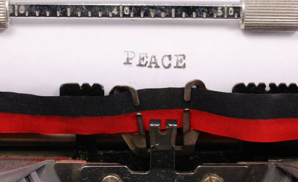 istock Typed PEACE inscription in black ink on paper with an old typewriter 2148523122