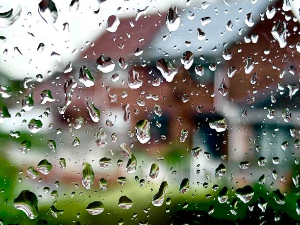 istock Looking out of a window on a rainy day 2148523386