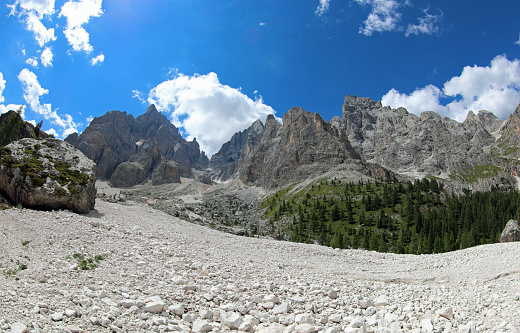 scree slope of mixed-sized rocks in the European Alps mountains of Italy in summer without people