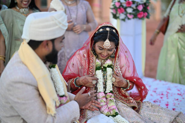 istock Indian bride and groom sharing laughter and joy together during their wedding ceremony 2148523740