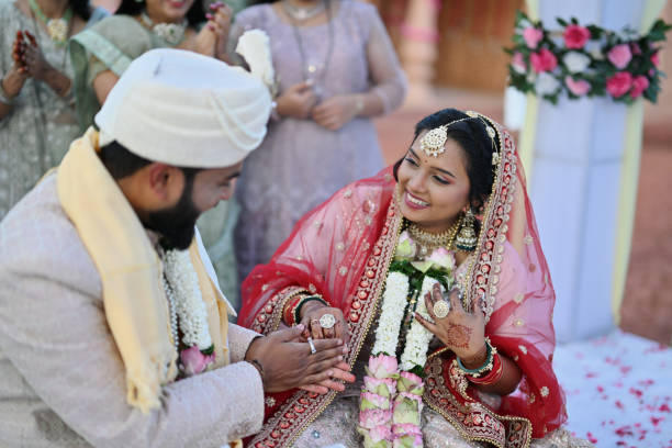 istock Indian bride and groom sharing laughter and joy together during their wedding ceremony 2148523741