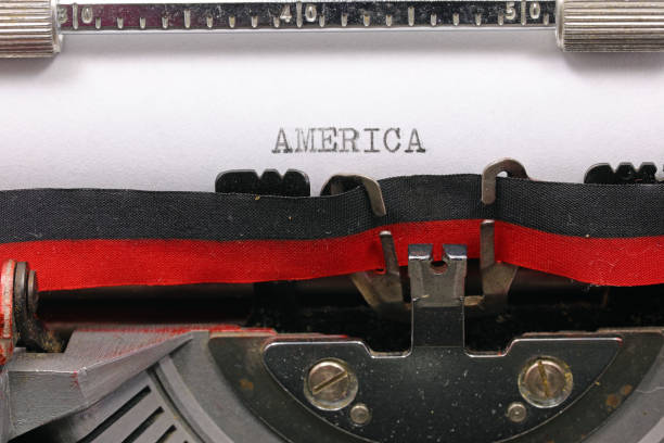 istock Typewritten AMERICA in black ink on white paper with an old typewriter 2148523775