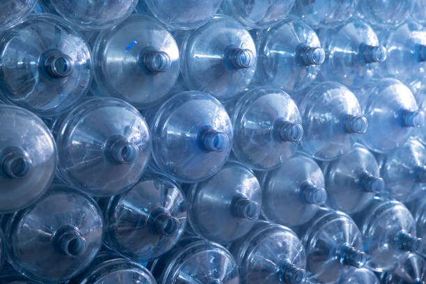 istock Background of large gallons on empty water bottle 2148524045