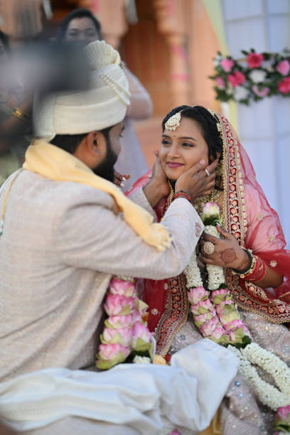 istock Bride and groom exchange happy glances during their wedding ceremony 2148524200