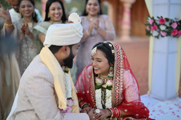 istock Indian bride and groom sharing laughter and joy together during their wedding ceremony 2148524517