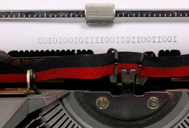 istock Binary sequence of zeros and ones written in black on a paper with a typewriter 2148524933
