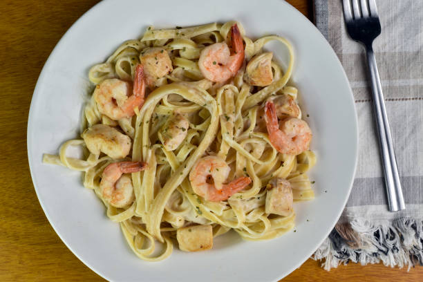 istock linguine alfredo top with  shrimp and chicken 2148525454