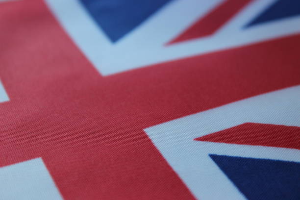 British flag. Macro photography of flag. The United Kingdom of Great Britain and Northern Ireland. Red, Blue, White