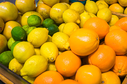 Winter farmers market display of citrus fruit including lemons, limes and grapefruit at a Lancaster County Farmers market.
