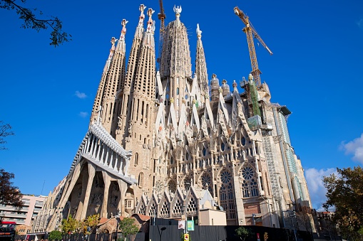 Barcelona, Spain - November 21, 2023: Facade of Sagrada Familia cathedral. Cathedral of La Sagrada Familia. It is designed by architect Antonio Gaudi and is being build since 1882