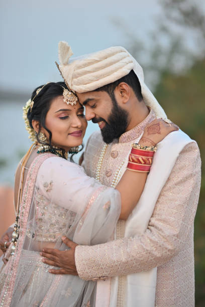 istock Bride & Groom embracing and holding each other 2148530700