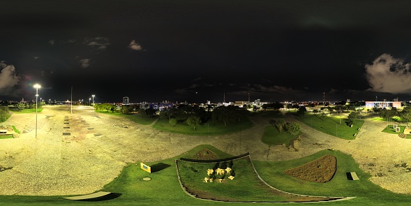 360 aerial photo taken with drone of the Monumento Súplica dos Pioneiros in Palmas, Tocantins, Brazil at night