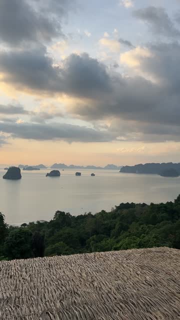 Island Sunset Panorama: Breathtaking Ocean View from Hilltop Bungalow - vertical video.