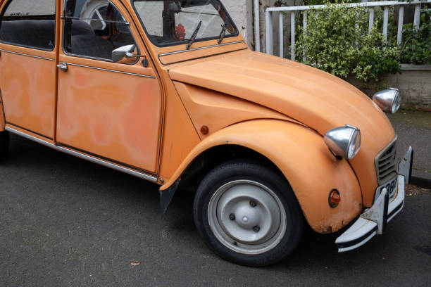 Norwich, Norfolk, UK  April 07 2024. Retro Citroen 2CV car parked facing downhill in a quiet street