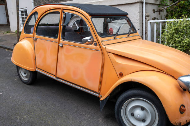 Norwich, Norfolk, UK  April 07 2024. Retro Citroen 2CV car parked facing downhill in a quiet street