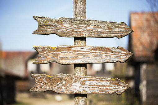 Hiking post in Triglav national park, Julian Alps, mountain range against clear sky.