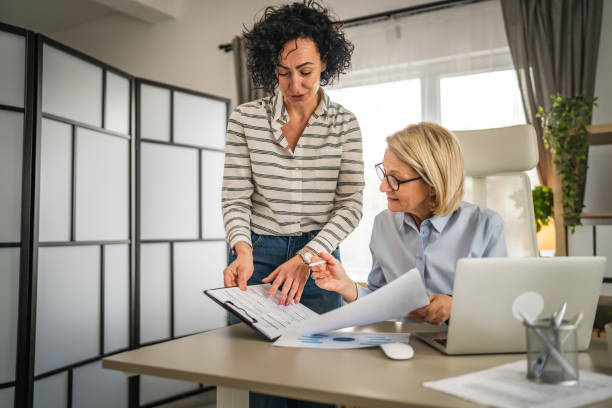 istock Two mature woman work and consult at office 2148533745