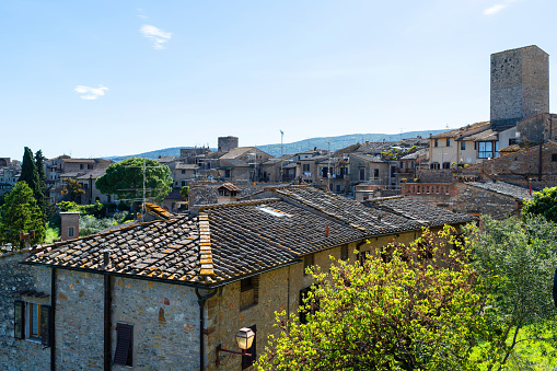 Cityscape of medieval Italian town, roofs of small houses, aerial view, Italy