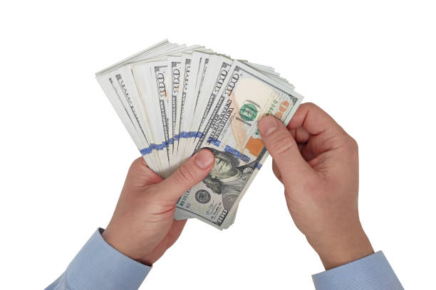 istock Businessman counting USA one hundred Dollar bills 2148535288