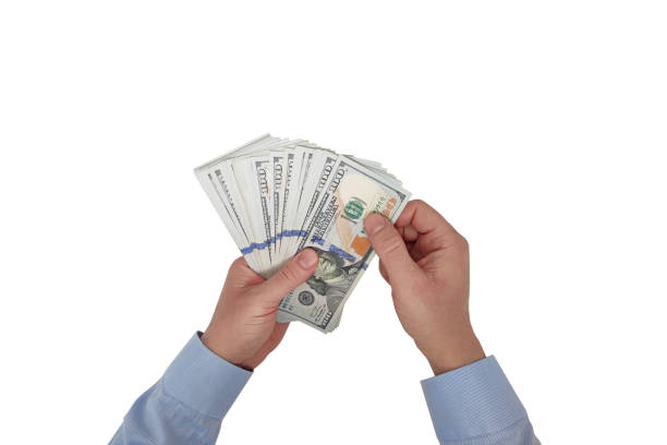 istock Businessman counting USA one hundred Dollar bills 2148535293