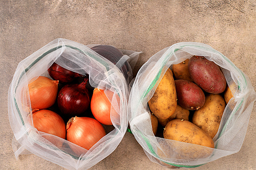 Healthy natural products in eco bag to boost immunity, healthy lifestyle concept, zero waste. Dietary vegetables in fabric packaging. Banner for the store. No plastic. Selective focus