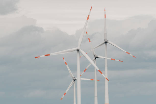 istock Close-up of wind turbines in strong wind and clouds 2148536299