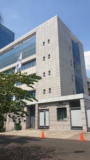 Tall building with Korean flag in front