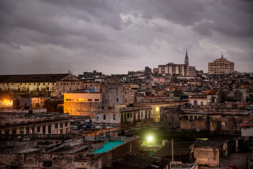 Looking out over the roof tops of central Havana at dusk and a moody sky