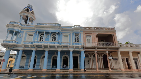 Cienfuegos, Cuba-October 11, 2019: East-looking facade of the Museo de Artes-Arts Museum and the Work and Social Security Provincial Direction, Eclectic-style buildings facing Plaza Jose Marti Square.