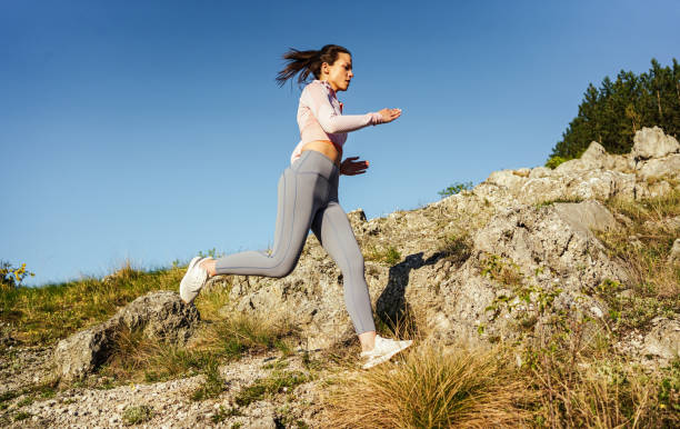 istock Female athlete is running uphill in the mountain 2148539725