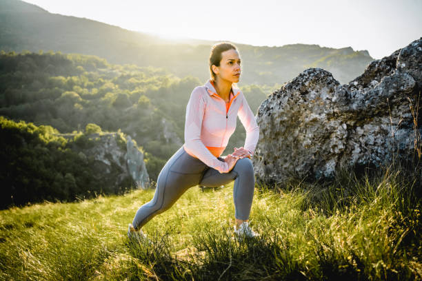 istock Active sporty woman stretching on the mountain 2148539797