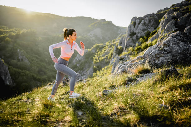 istock Female runner ascending mountain ridge 2148539836