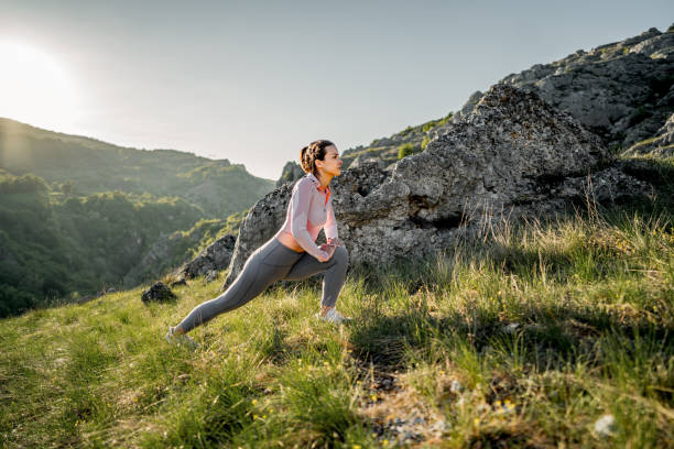 istock Sporty woman stretching on the mountain 2148540111