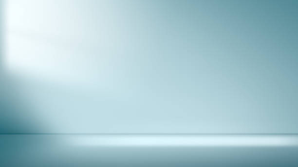 istock abstract minimal light blue background for product presentation. Shadow and light from windows on plaster wall. 2148540129