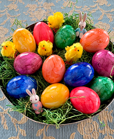 close-up of multi colored easter\neggs in bowl