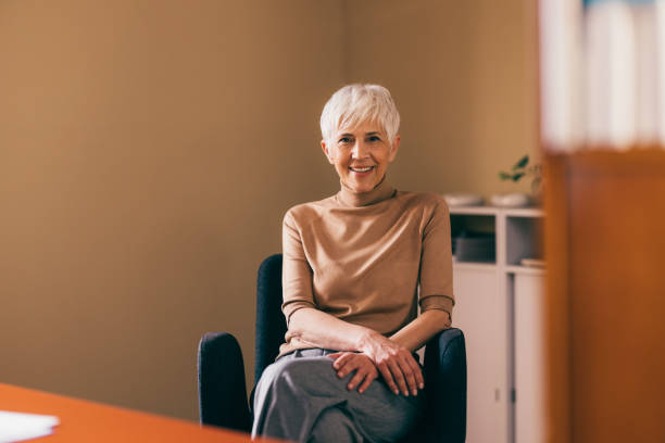 istock Confident Businesswoman Smiling in Modern Office Setting 2148542723