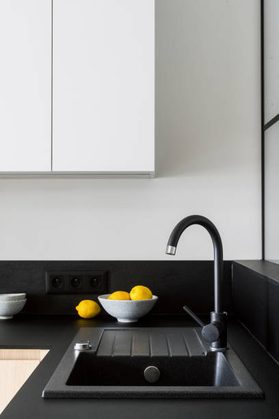 istock Modern granite sink and black faucet at kitchen with contemporary interior 2148543228