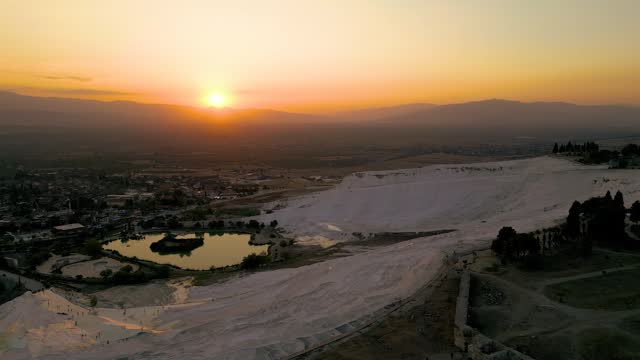 Pamukkale Travertines Cinematic Aerial Drone footage. Turkish famous white thermal bath with healthy clean water .