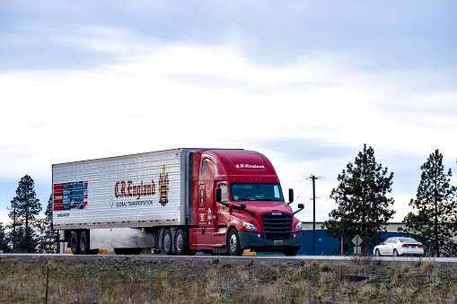 C.R. England semi-truck with a refrigerated trailer on Interstate 90 in Spokane, Washington in January 2019.
C.R. England is long haul trucking company based in Salt Lake City, Utah.
