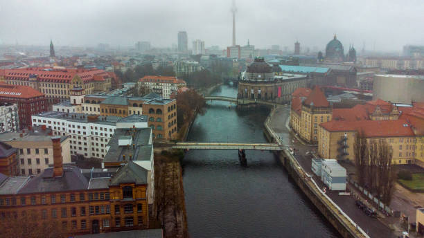 istock Awe Drone view on Weidendammer Brucke (bridge) and Ebertsbrucke over Spree river and  Bode-Museum in foggy Berlin 2148544982